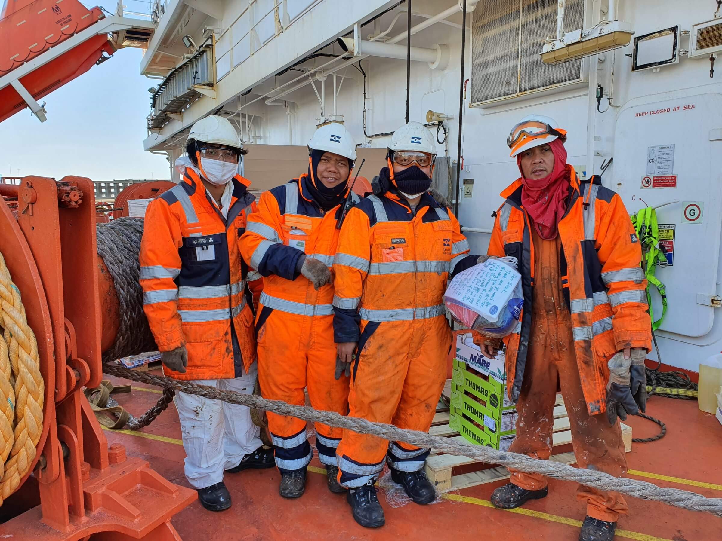Maritime professionals together at sea